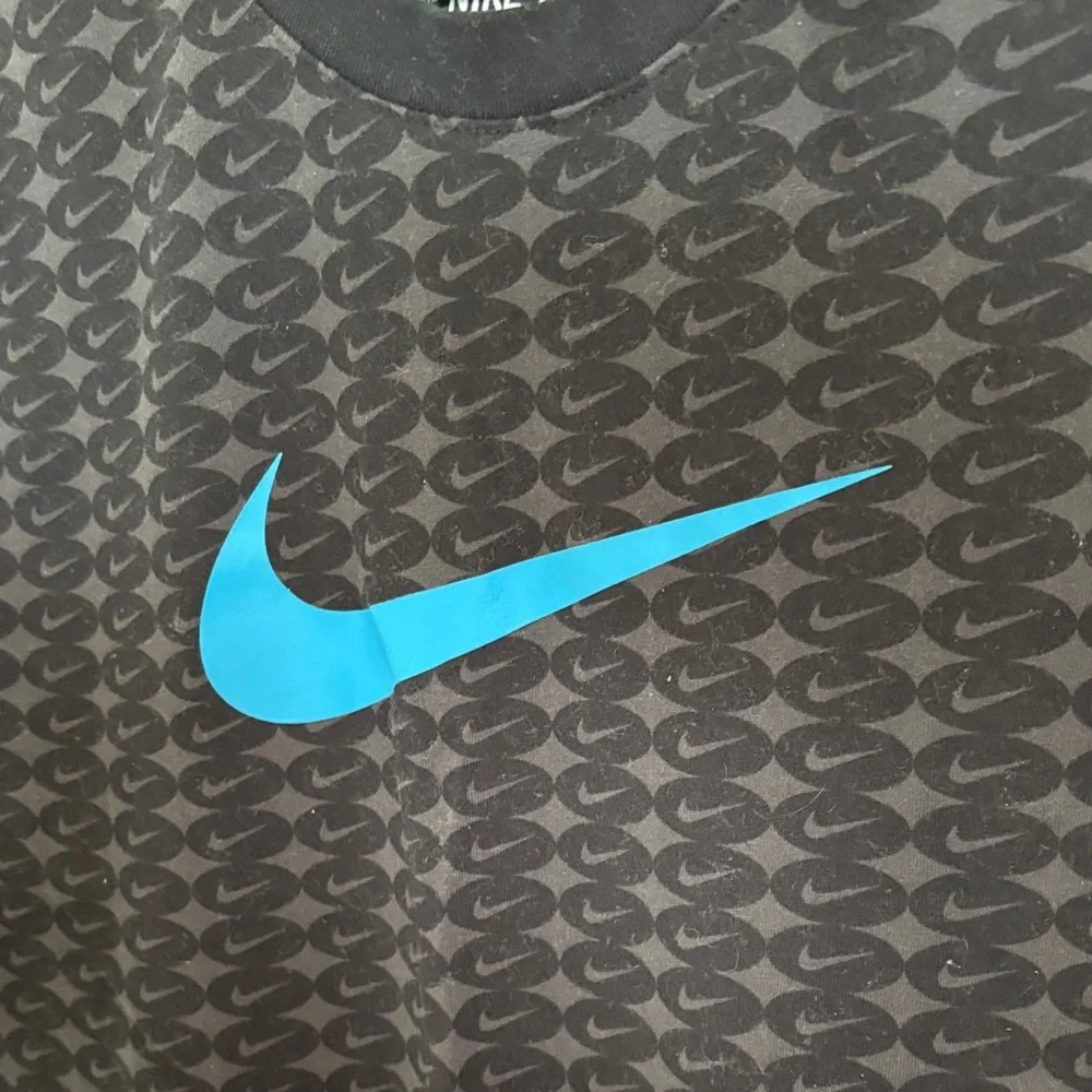 Nike Black Short-Sleeve Tee with Bright Blue Swoosh